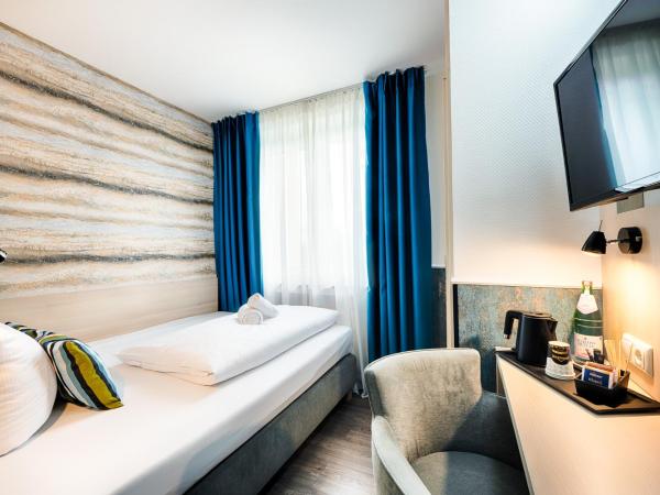 Home Hotel : photo 1 de la chambre chambre simple