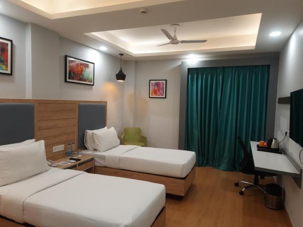 Inde Hotel Sec- 49, Golf Course Extension, Gurgaon : photo 6 de la chambre chambre lits jumeaux