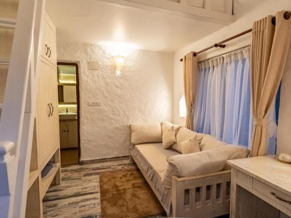 Purna : photo 1 de la chambre chambre familiale - vue sur jardin
