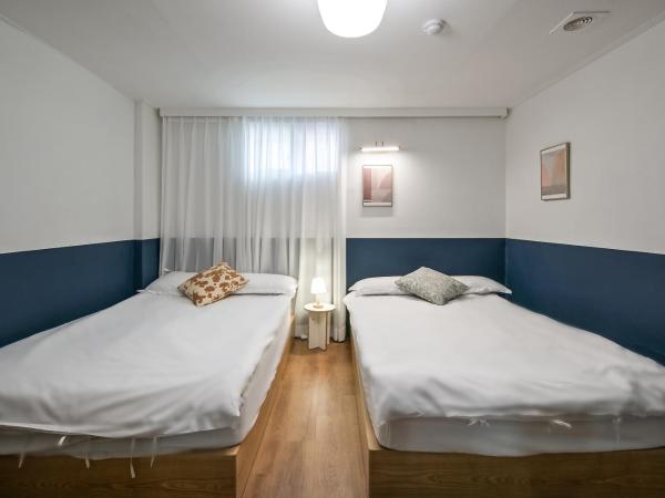 SSH Myeongdong Dongdo Hostel : photo 10 de la chambre chambre quadruple