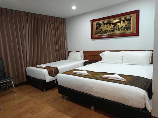 Longzhu Guesthouse : photo 2 de la chambre chambre triple deluxe