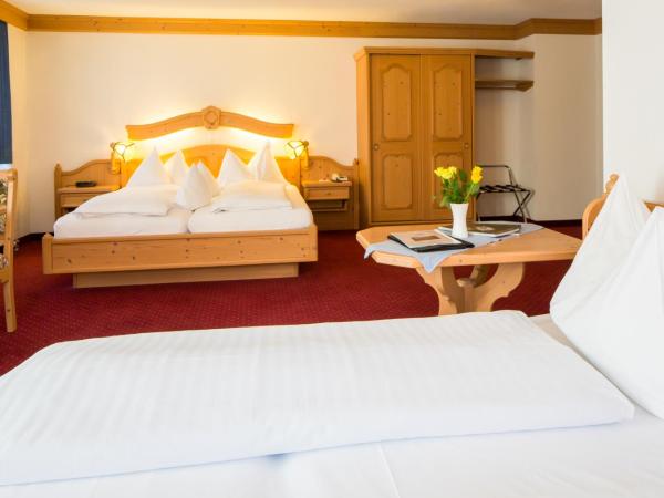 Hotel Grindelwalderhof : photo 1 de la chambre chambre quadruple