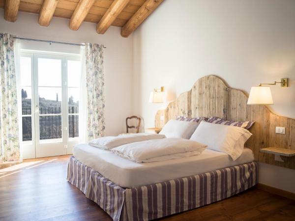 La Vineria di San Mattia : photo 2 de la chambre chambre double ou lits jumeaux deluxe – vue sur jardin
