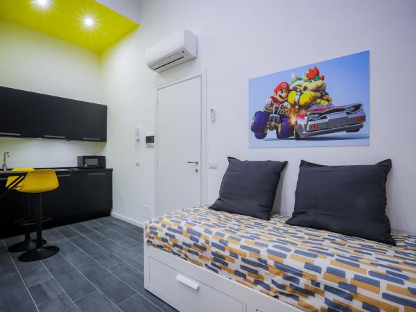 Napoli Games Apartments by Dimorra : photo 4 de la chambre chambre quadruple deluxe