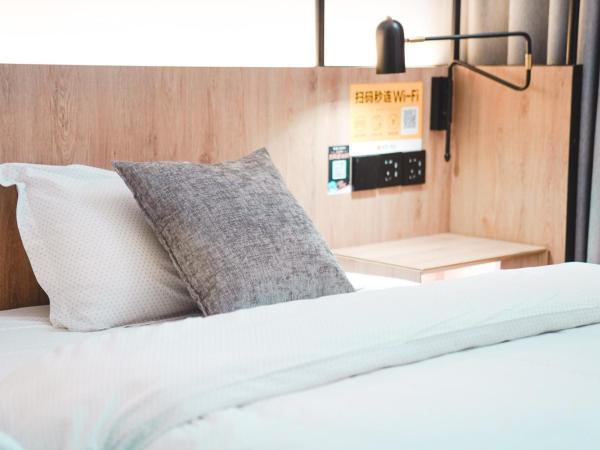 POSHPACKER·Chengdu Local Tea Hostel : photo 5 de la chambre chambre lits jumeaux de luxe avec salle de bains privée