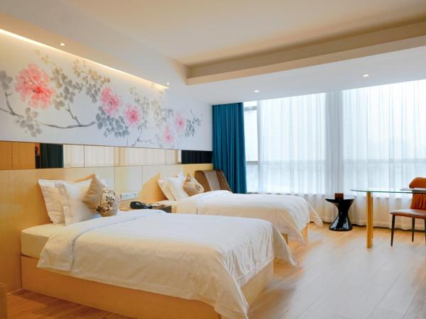 Paco Hotel Tuanyida Metro Guangzhou-Canton Fair free shuttle bus : photo 1 de la chambre chambre lits jumeaux de caractère