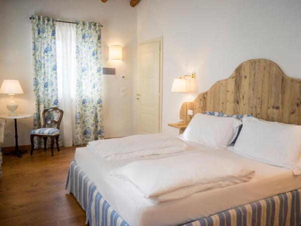 La Vineria di San Mattia : photo 3 de la chambre chambre double ou lits jumeaux supérieure - vue sur jardin