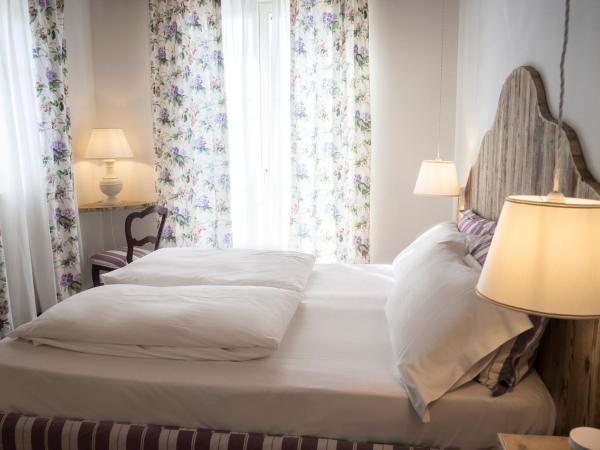 La Vineria di San Mattia : photo 3 de la chambre chambre double ou lits jumeaux standard - vue sur jardin