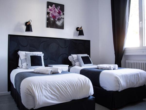 Hôtel Le Tivoli : photo 8 de la chambre chambre lits jumeaux confort