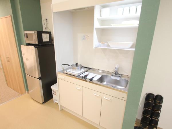 LUANAHOTEL IN KOUENJI : photo 7 de la chambre suite familiale