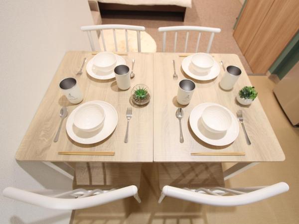 LUANAHOTEL IN KOUENJI : photo 8 de la chambre suite familiale