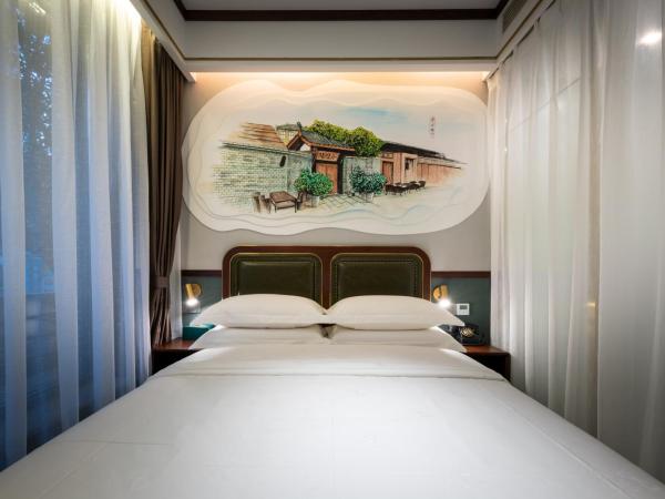Time Traveller Boutique Hotel -Near Chengdu Wide narrow lane, People's Park, Chengdu Panda Base, 10 minutes walk to subway , Eat chaffy dish, Free night snack, Free laundry, English communication well, Free travel advice : photo 2 de la chambre chambre double standard