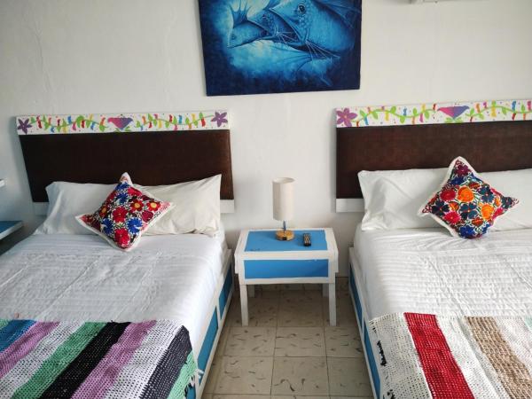 T´úubul K´iin Bed & Breakfast : photo 4 de la chambre chambre lits jumeaux