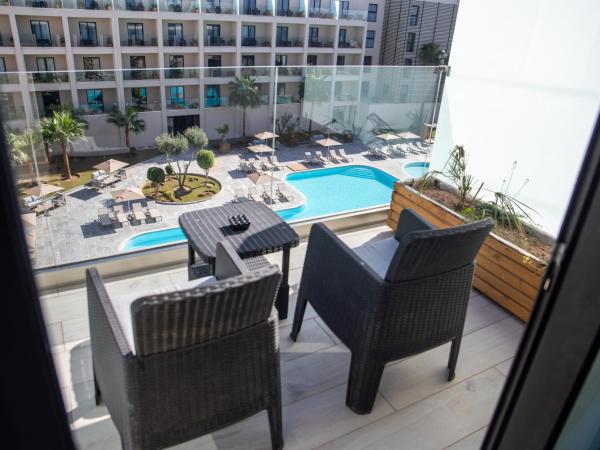 Dominium Palace : photo 1 de la chambre chambre familiale deluxe - vue sur piscine