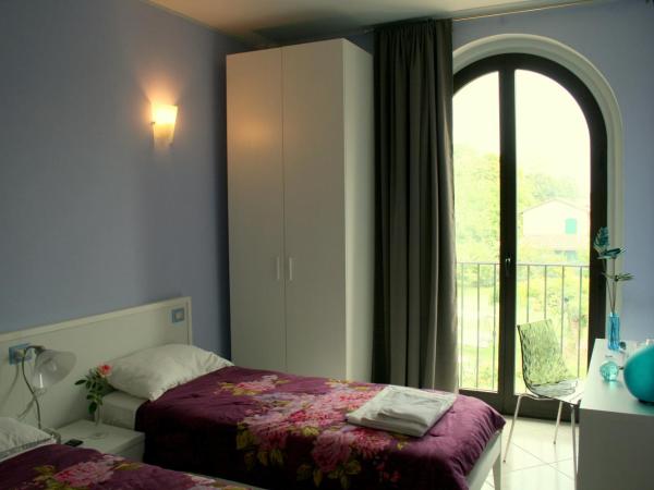 Agriturismo Argaland : photo 10 de la chambre chambre double ou lits jumeaux - vue sur jardin