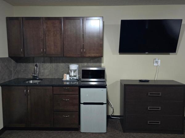 Royal Lodge : photo 2 de la chambre chambre lit king-size avec baignoire spa