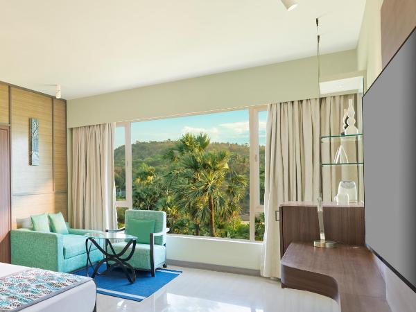 The Resort : photo 5 de la chambre hébergement de luxe - vue sur jardin