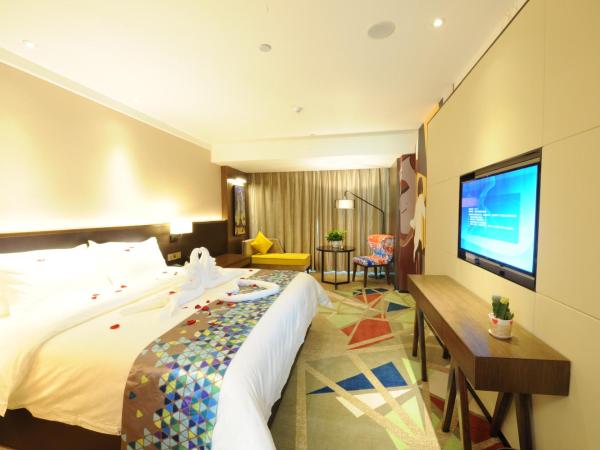 Chao Man Hotel - Guangzhou Railway Station Sanyuanli Metro Station : photo 1 de la chambre chambre supérieure lit queen-size