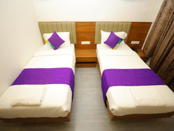 Silverkey Hotel Yelahanka : photo 1 de la chambre chambre double ou lits jumeaux