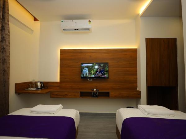 Silverkey Hotel Yelahanka : photo 5 de la chambre chambre double ou lits jumeaux