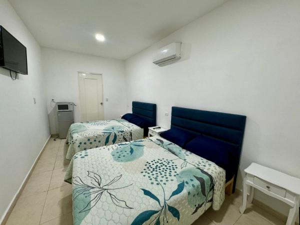 Isla Venados Habitaciones Vacacionales : photo 2 de la chambre chambre quadruple avec salle de bains privative