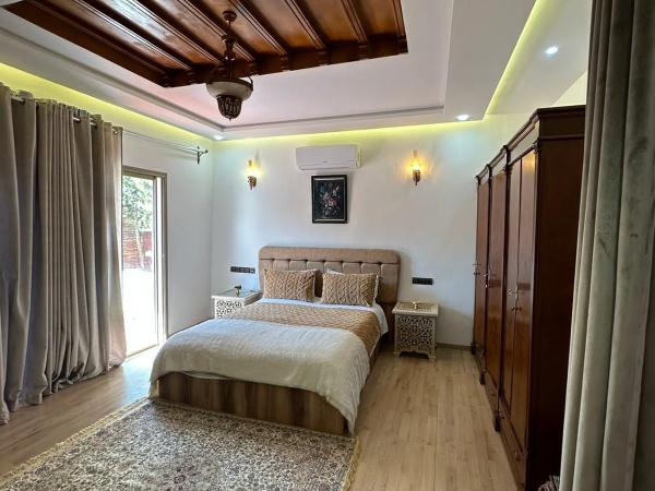 Maison d'hôtes La Ferme AZIZA : photo 2 de la chambre bungalow - vue sur jardin