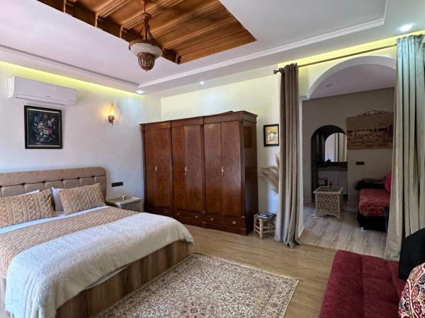 Maison d'hôtes La Ferme AZIZA : photo 3 de la chambre bungalow - vue sur jardin