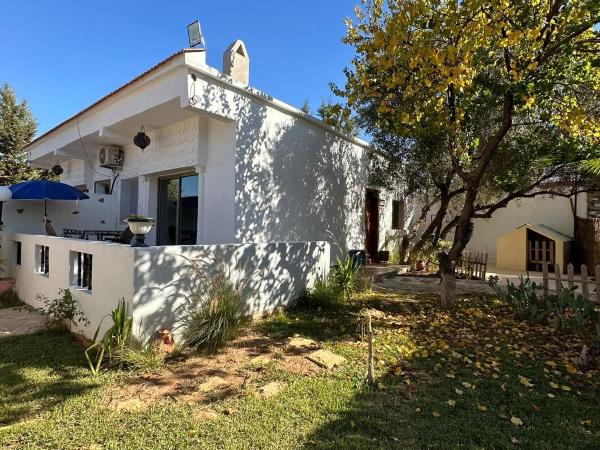 Maison d'hôtes La Ferme AZIZA : photo 5 de la chambre bungalow - vue sur jardin