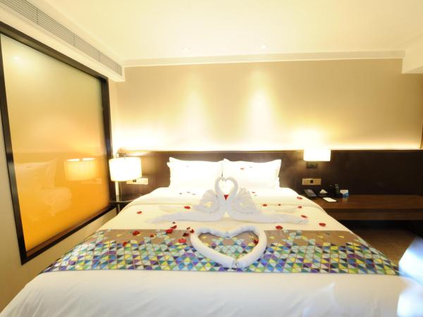 Chao Man Hotel - Guangzhou Railway Station Sanyuanli Metro Station : photo 3 de la chambre chambre supérieure lit queen-size