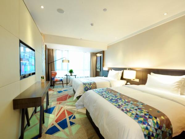 Chao Man Hotel - Guangzhou Railway Station Sanyuanli Metro Station : photo 2 de la chambre chambre lits jumeaux supérieure