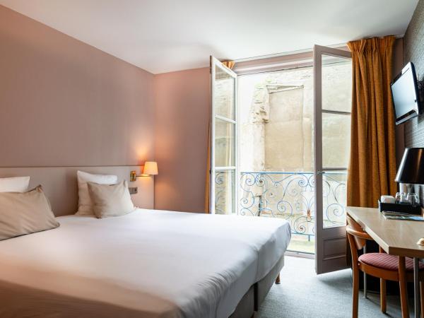 Hôtel de la Cité : photo 4 de la chambre chambre double ou lits jumeaux standard avec vue partielle sur la mer