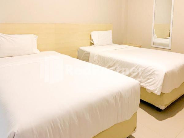 Hotel Andono near YIA Mitra RedDoorz : photo 1 de la chambre chambre lits jumeaux deluxe