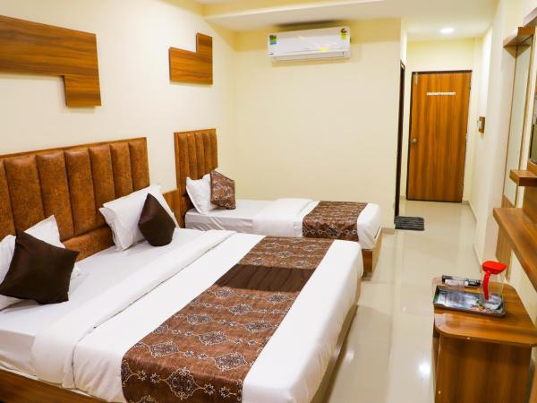 Hotel The Grand : photo 1 de la chambre chambre triple