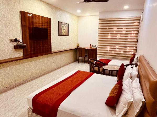 Amora Rooms Dwarka : photo 1 de la chambre chambre triple supérieure