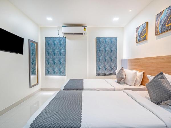 Eminent Suites and Apartments : photo 2 de la chambre chambre deluxe double ou lits jumeaux