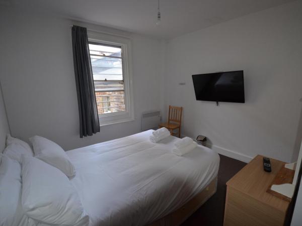 Central Comfort Rooms : photo 1 de la chambre deluxe double room with private shower and shared toilet