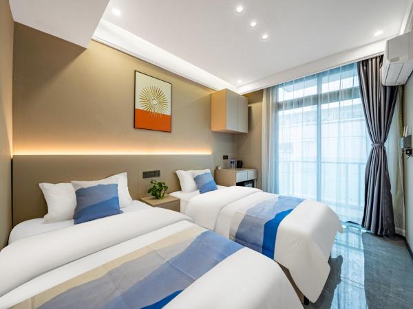 Yozo Serviced Apartment : photo 3 de la chambre chambre lits jumeaux avec balcon