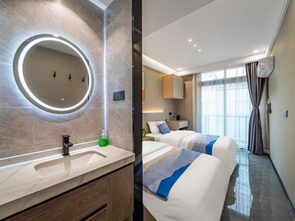 Yozo Serviced Apartment : photo 5 de la chambre chambre lits jumeaux avec balcon