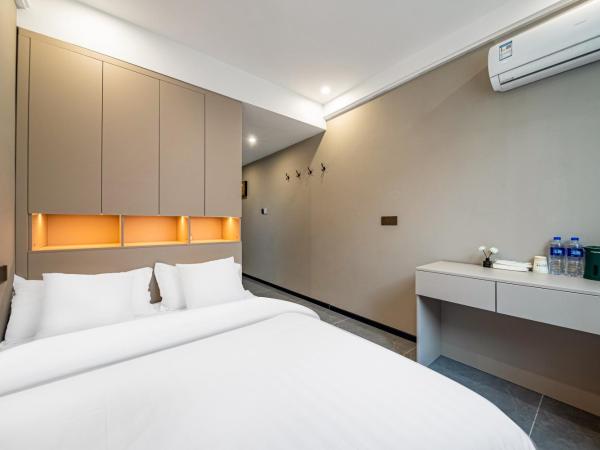 Yozo Serviced Apartment : photo 2 de la chambre studio lit queen-size 