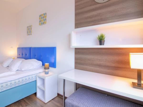 High Tower Szczecin : photo 5 de la chambre studio lit king-size avec canapé-lit