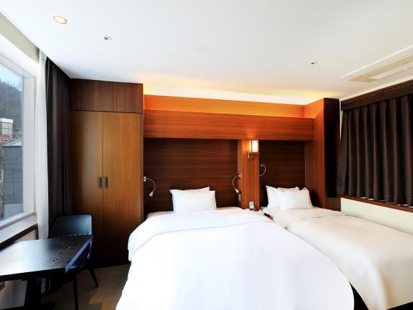 CS Avenue Tourist Hotel : photo 1 de la chambre chambre double ou lits jumeaux