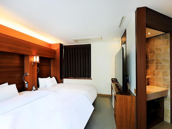 CS Avenue Tourist Hotel : photo 2 de la chambre chambre double ou lits jumeaux