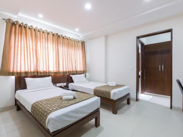 Sanctum Suites BEL Road Bangalore : photo 1 de la chambre chambre lits jumeaux standard