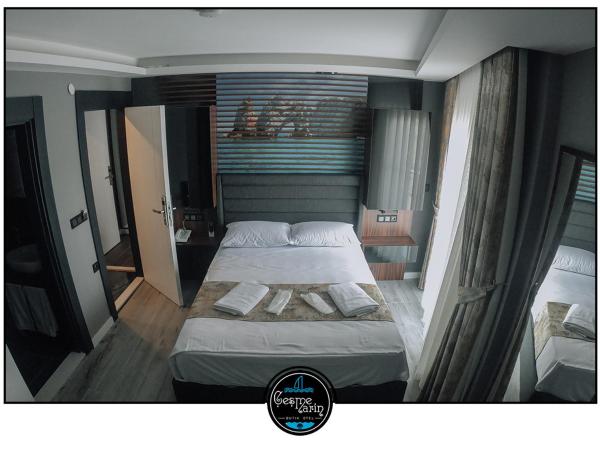 çesme marin butik otel : photo 1 de la chambre chambre triple de luxe