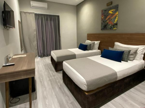 Eventi Club by cité des sports adarissa : photo 5 de la chambre chambre lits jumeaux