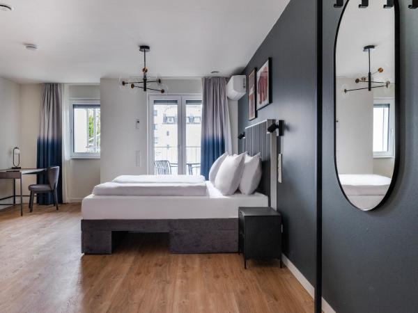 numa I Leo Apartments : photo 1 de la chambre studio familial