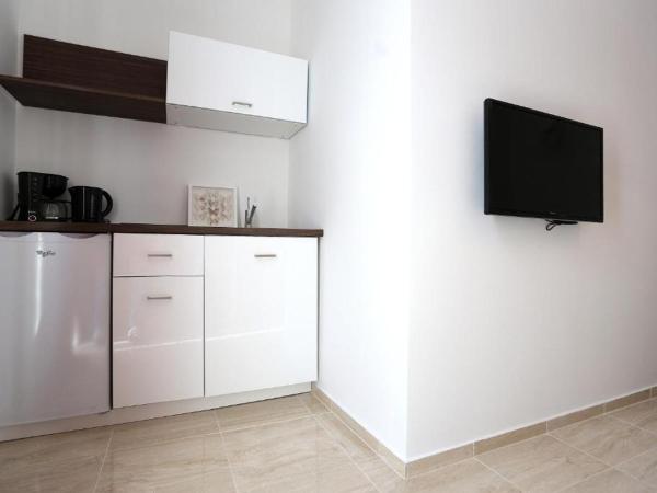 Guesthouse Villa Maggie : photo 10 de la chambre studio lit queen-size de luxe