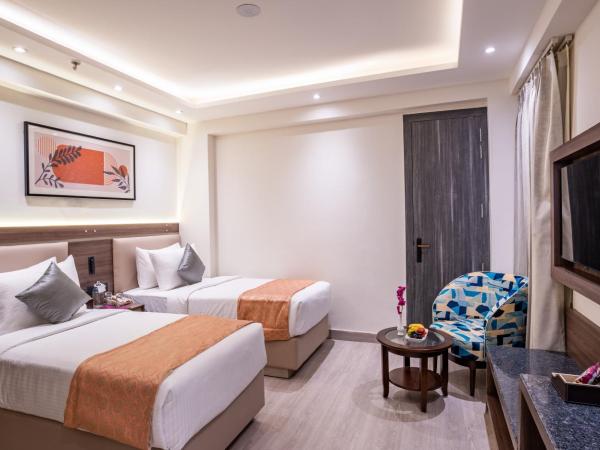 Regenta Inn Gurugram : photo 2 de la chambre chambre lits jumeaux deluxe
