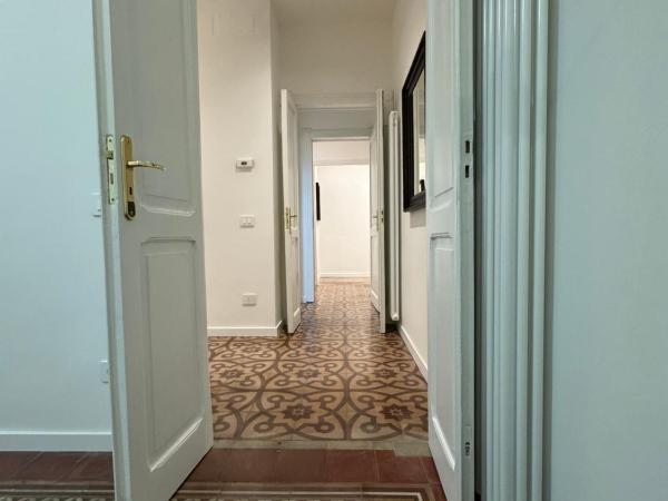 Noliday Savona Center Art Deco Apartment : photo 2 de la chambre chambre triple avec salle de bains privative