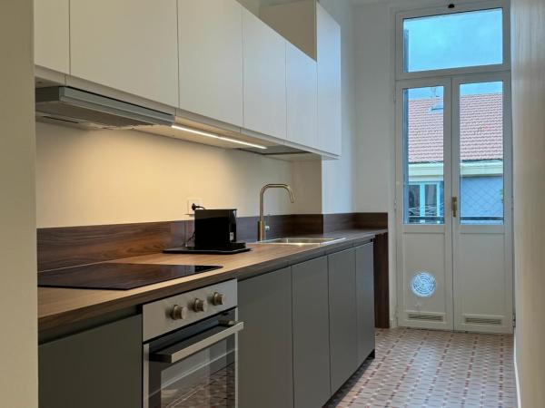 Noliday Savona Center Art Deco Apartment : photo 8 de la chambre chambre triple avec salle de bains privative